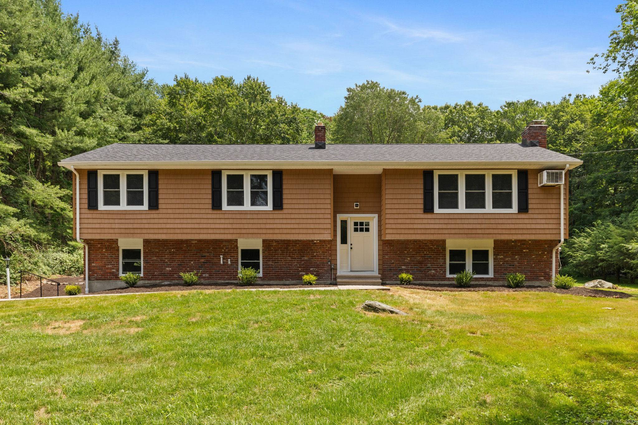 Welcome to this beautifully updated raised ranch nestled in the heart of Sandy Hook, CT.