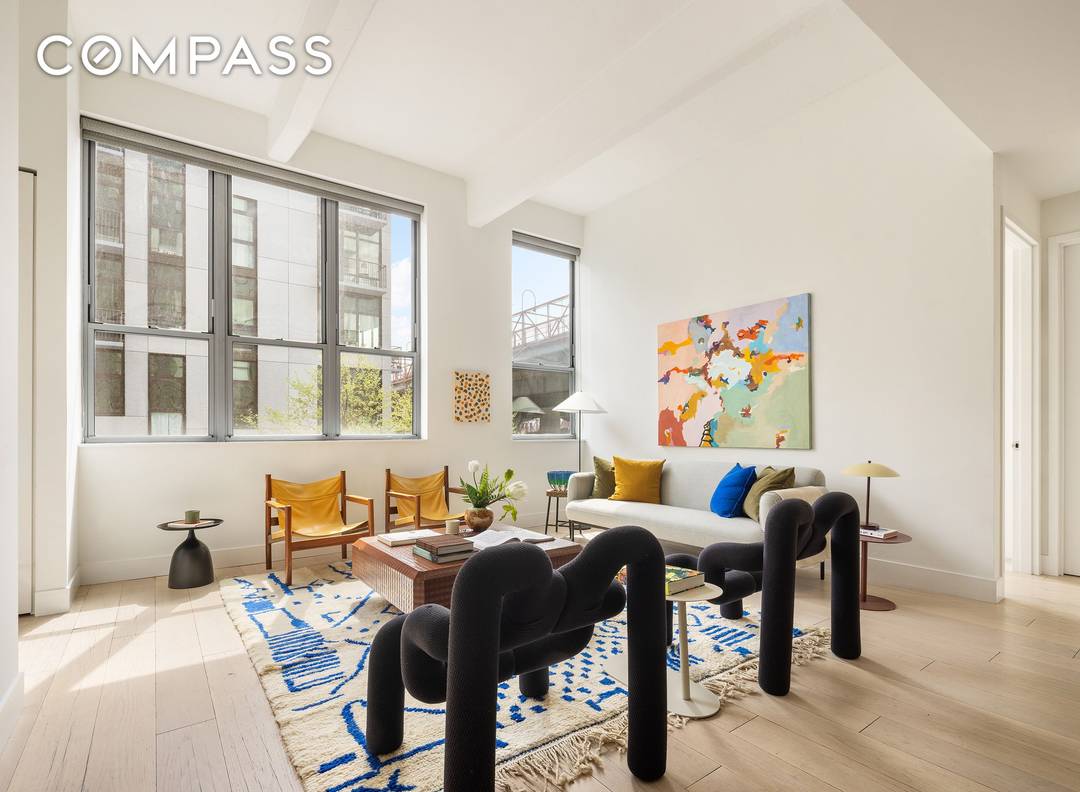 Welcome home to residence 2E at 338 Berry Street, a former factory converted to a full service, 60 unit loft condominium.