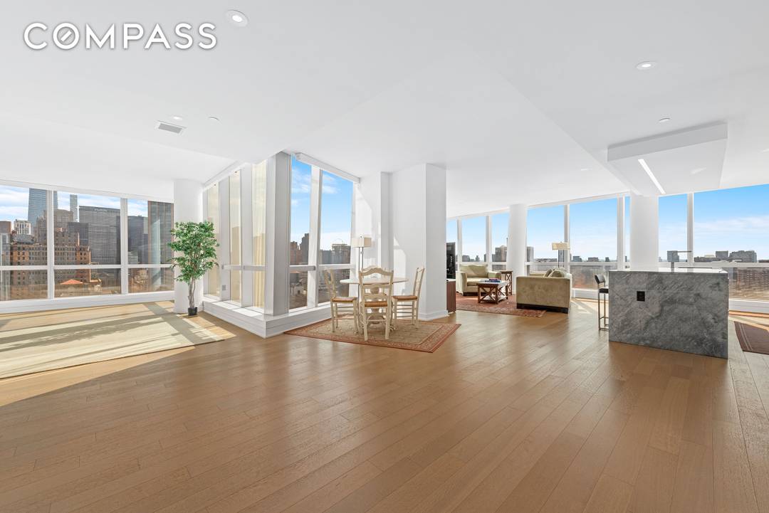 Floor to ceiling skyline city views from this huge newly constructed three bedroom plus study, three full baths.
