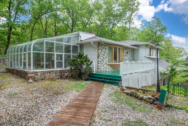 Don't miss this large custom ranch on a private wooded lot.