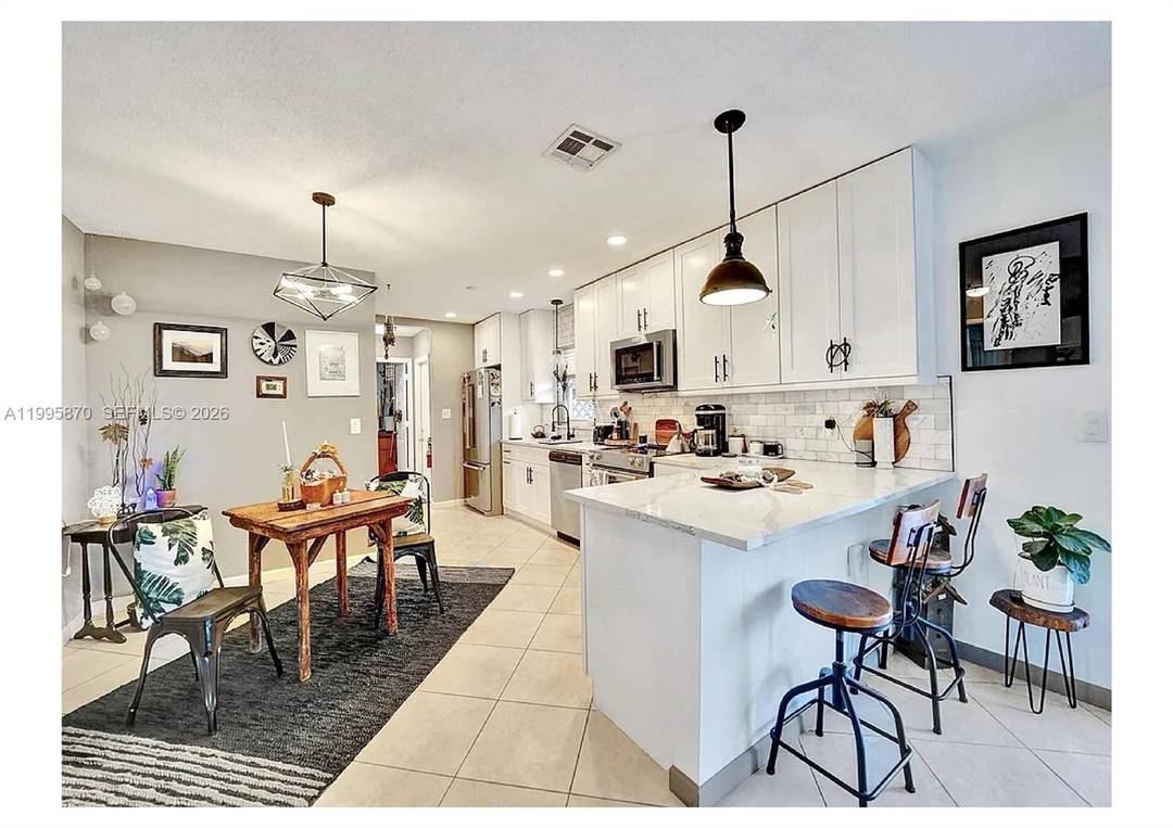 Rare opportunity to own a thoughtfully updated 3 bedroom, 3 bath home in Oakland Park s Andrews Gardens, directly adjacent to Wimberly Fields Park and Giusti Heart ParCous Park.