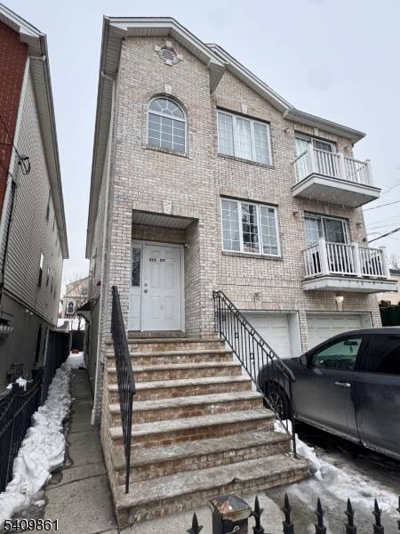 Newer Three Family Home Located near Branch Brook Park, GS Parkway Newark Schools Stadium Featuring Brick Front, Hardwood Floors, Central Air, 2 Car Garage, Low Taxes much more