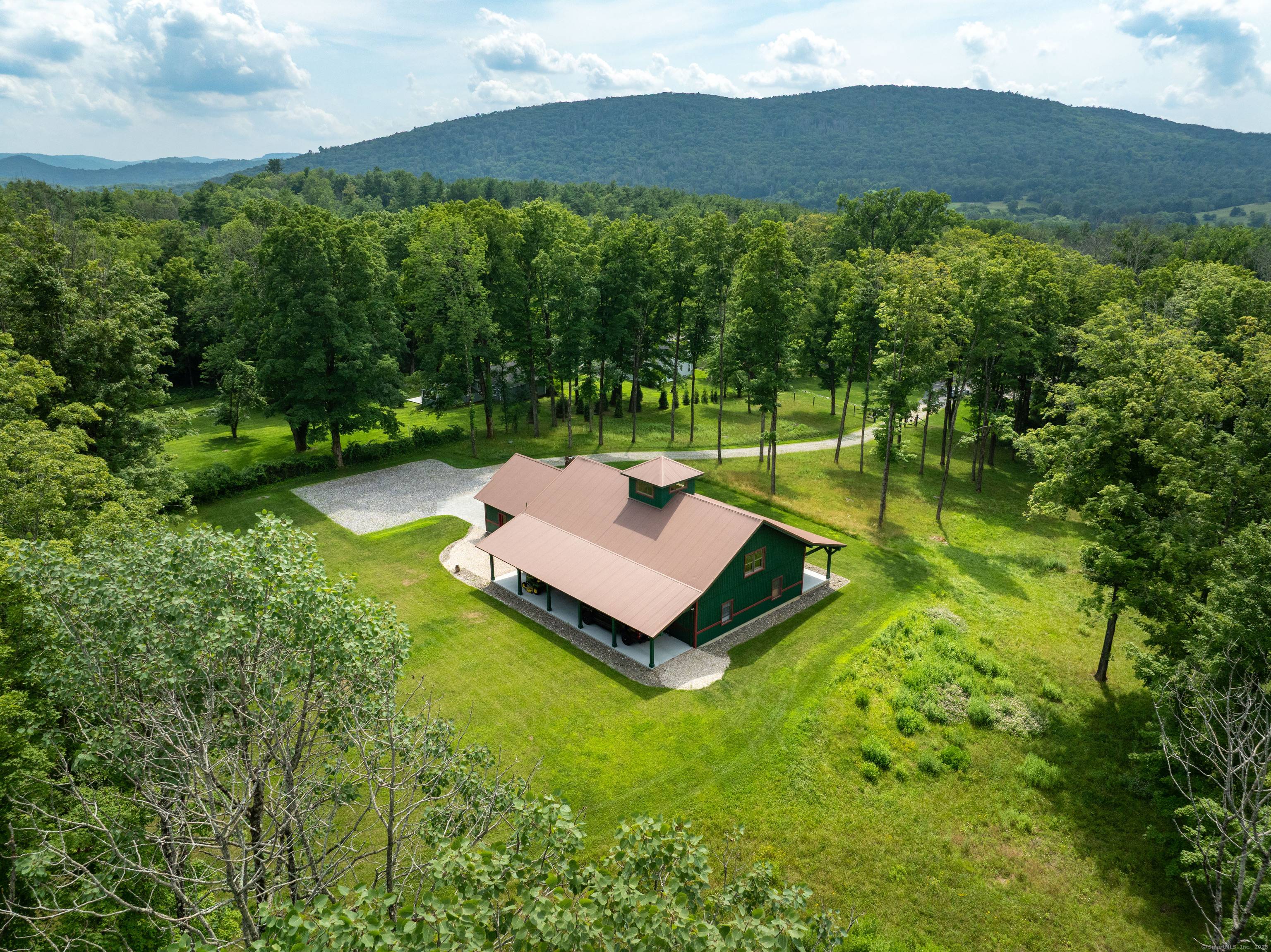 Set high on a hill and privately tucked back from the road, this custom built Post Beam home is a rare blend of craftsmanship, comfort, and sustainability.