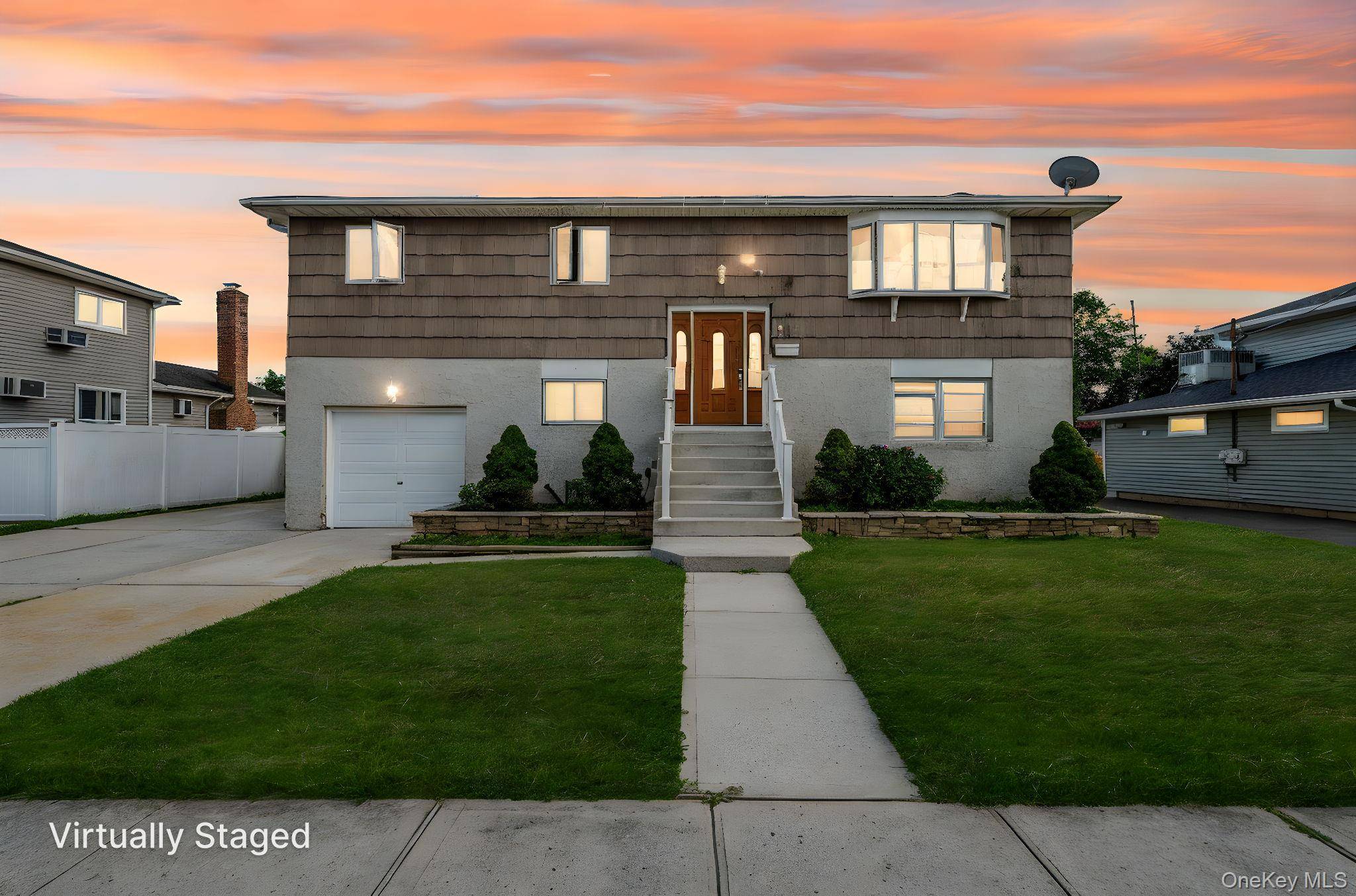 Welcome to this stunning High Ranch in Massapequa, offering 2, 200 sq ft of beautifully renovated living space.