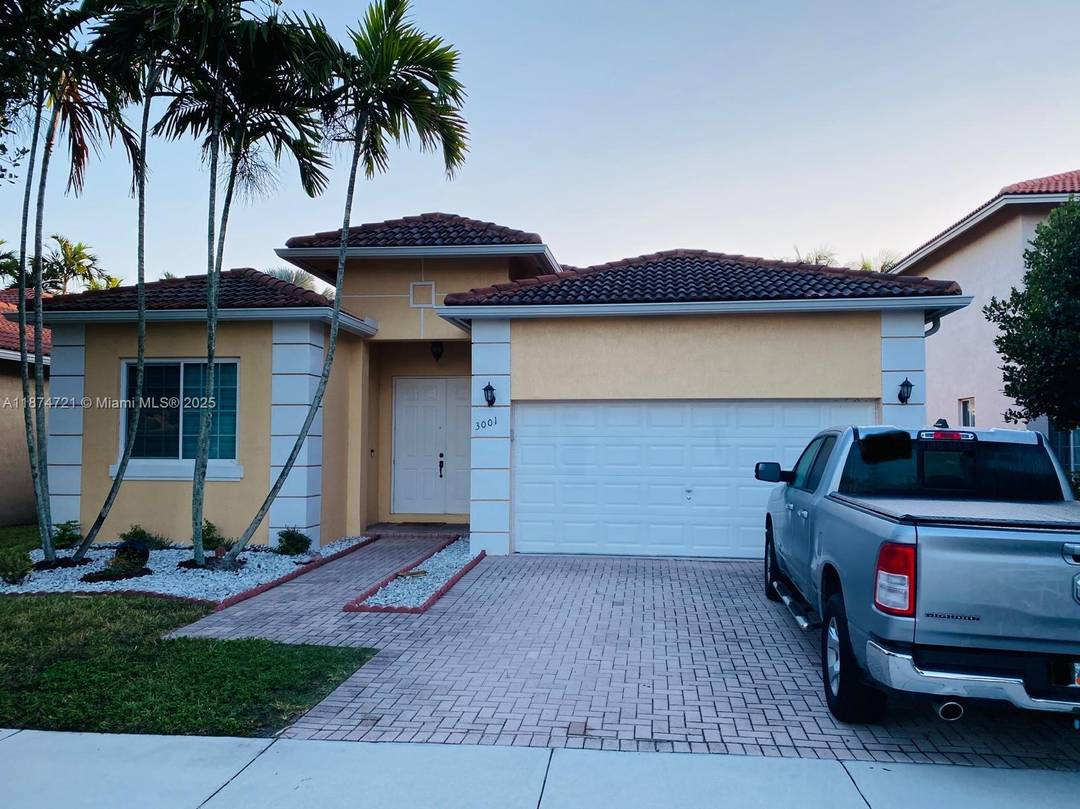 Lakefront living meets everyday comfort in this 4 bedroom, 3 bath pool home located inside the sought after gated community of Monarch Lakes in Miramar.