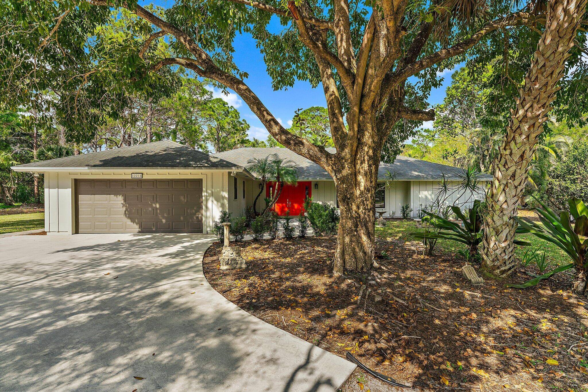 Enjoy your privacy with this 4 bedroom, 2 bathroom Jupiter Farms pool home, offering 2, 816 sq.
