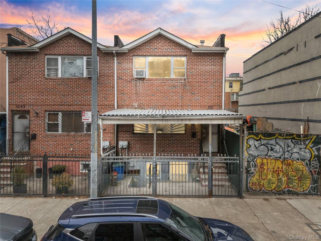 Investor Opportunity ! Solid brick semi detached two family property featuring two spacious 3 bedroom, 2 bathroom apartments and a finished walk out basement.