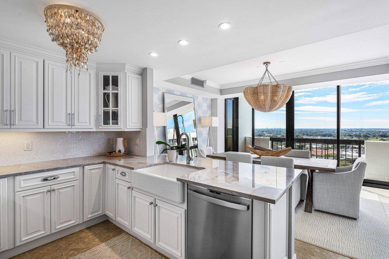 Escape to paradise in this exquisite FULLY UPDATED penthouse unit at 108 Lakeshore Drive, nestled within the prestigious Marina Tower at Old Port Cove.