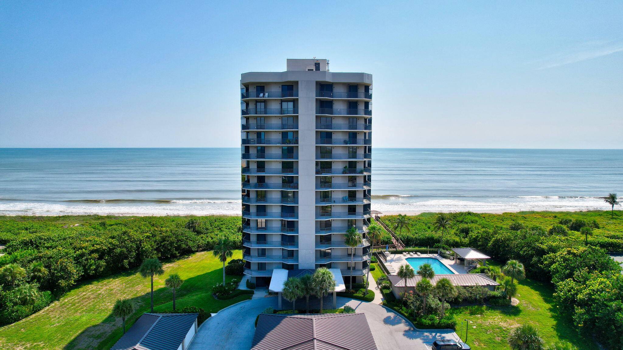 Perched elegantly on the 4th floor, this luxurious oceanfront condo on North Hutchinson Island captures the essence of sophisticated coastal living.