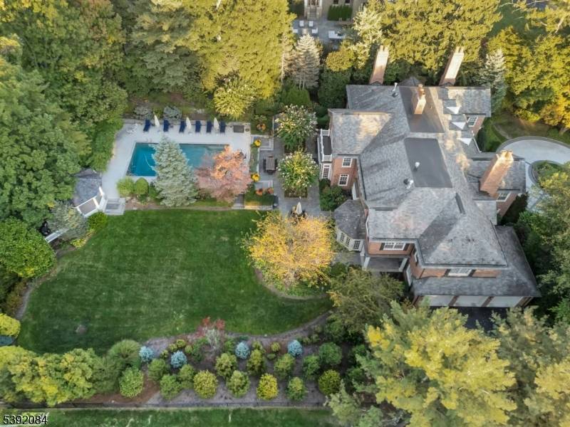 Set on nearly an acre along one of Short Hills' most coveted streets, this Georgian Colonial estate blends timeless architecture with refined modern luxury.