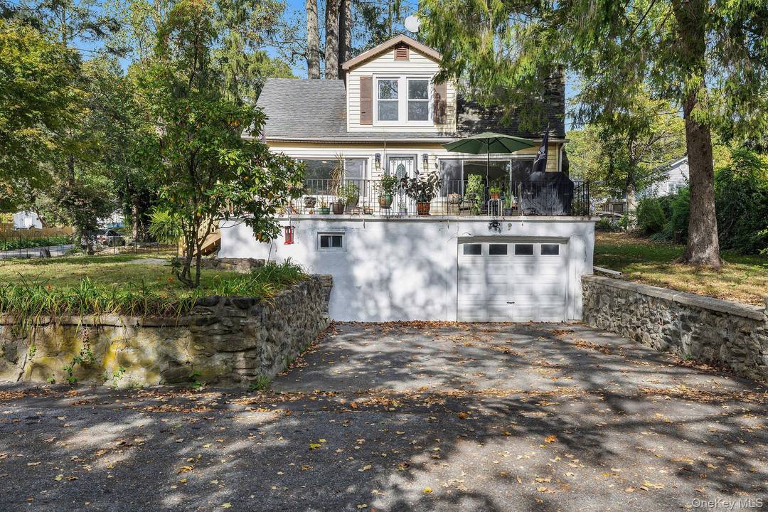 Welcome to this charming 3 bedroom 2 bathroom Cape Cod style home situated on a spacious corner lot in Lake Carmel.
