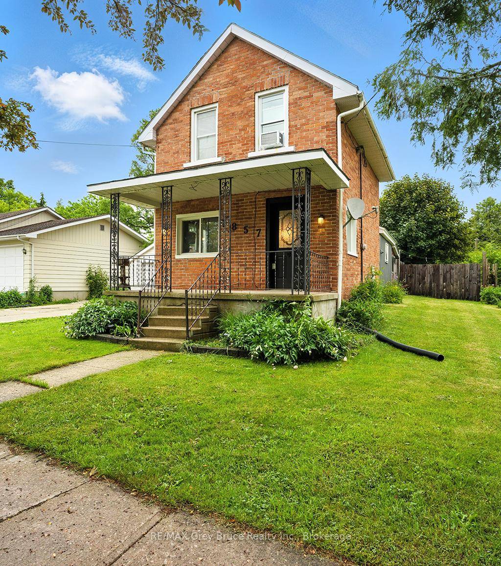 Excellent East side 1. 5 story home with detached garage and a 185 foot deep lot.