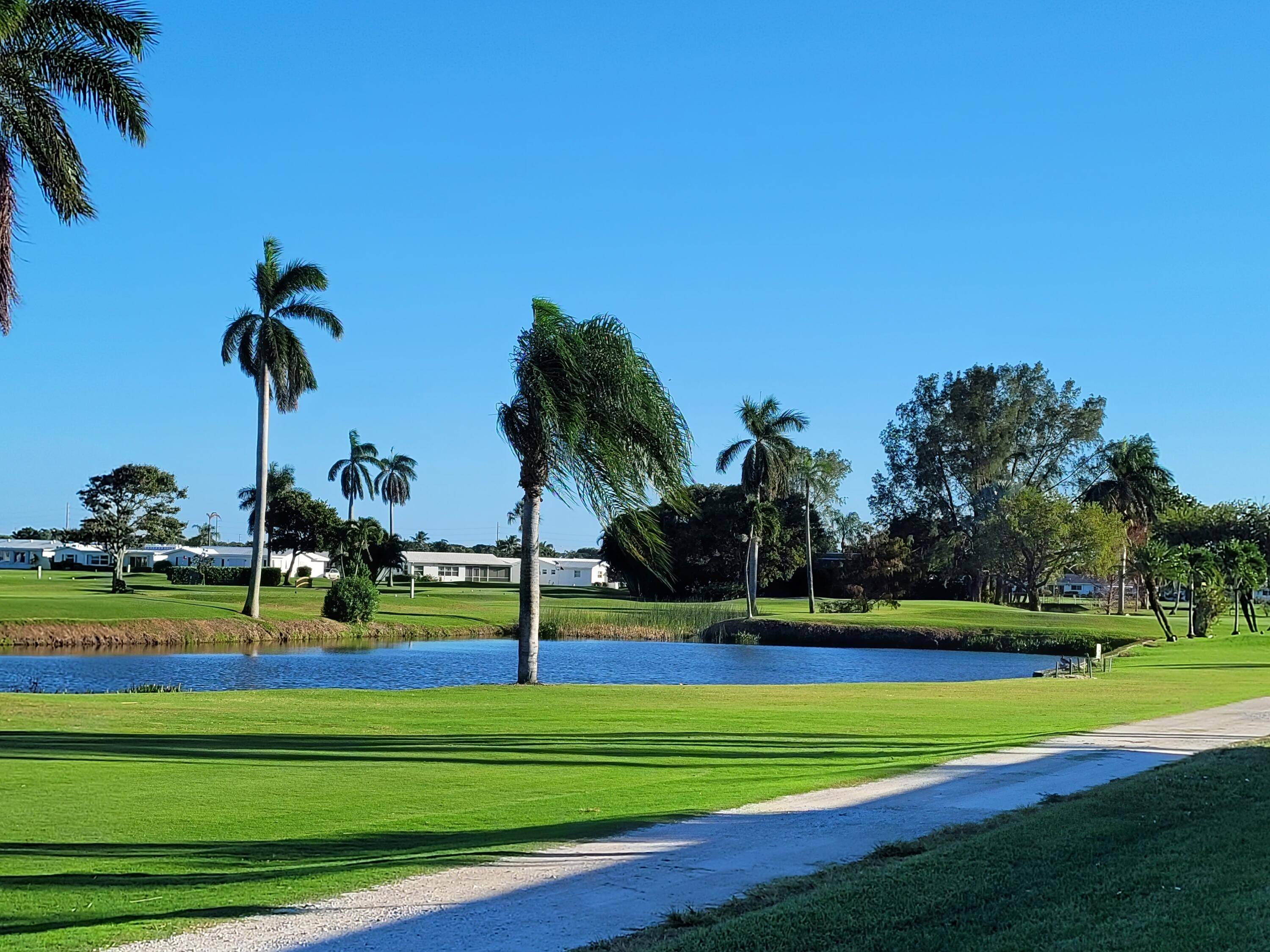 CALLING ALL GOLFERS This Elegant Villa and it's beautifully maintained 18 hole Golf Course Awaits You in Sunny South Florida's Paradise.