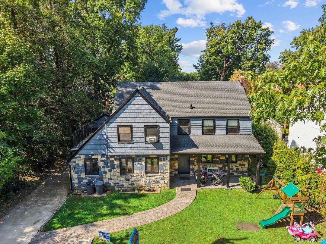 Welcome to this beautifully renovated, sun drenched home on a quiet, tree lined residential street.