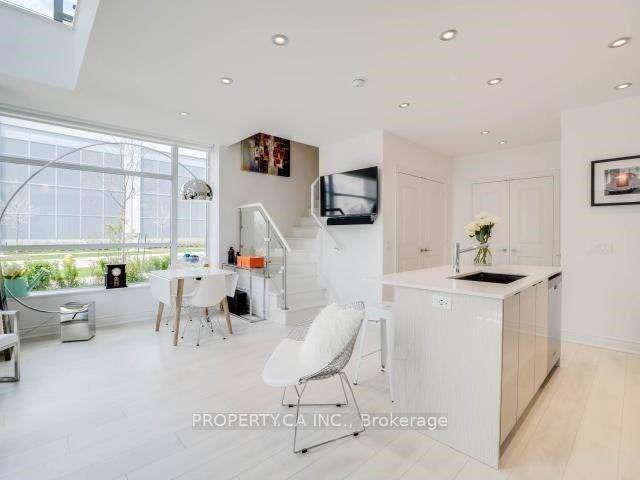 Stunning Modern 2 Storey Corner Loft Style Condo with 2 Parking Spaces, Locker, Terrace amp ; Steps from the Waterfront.
