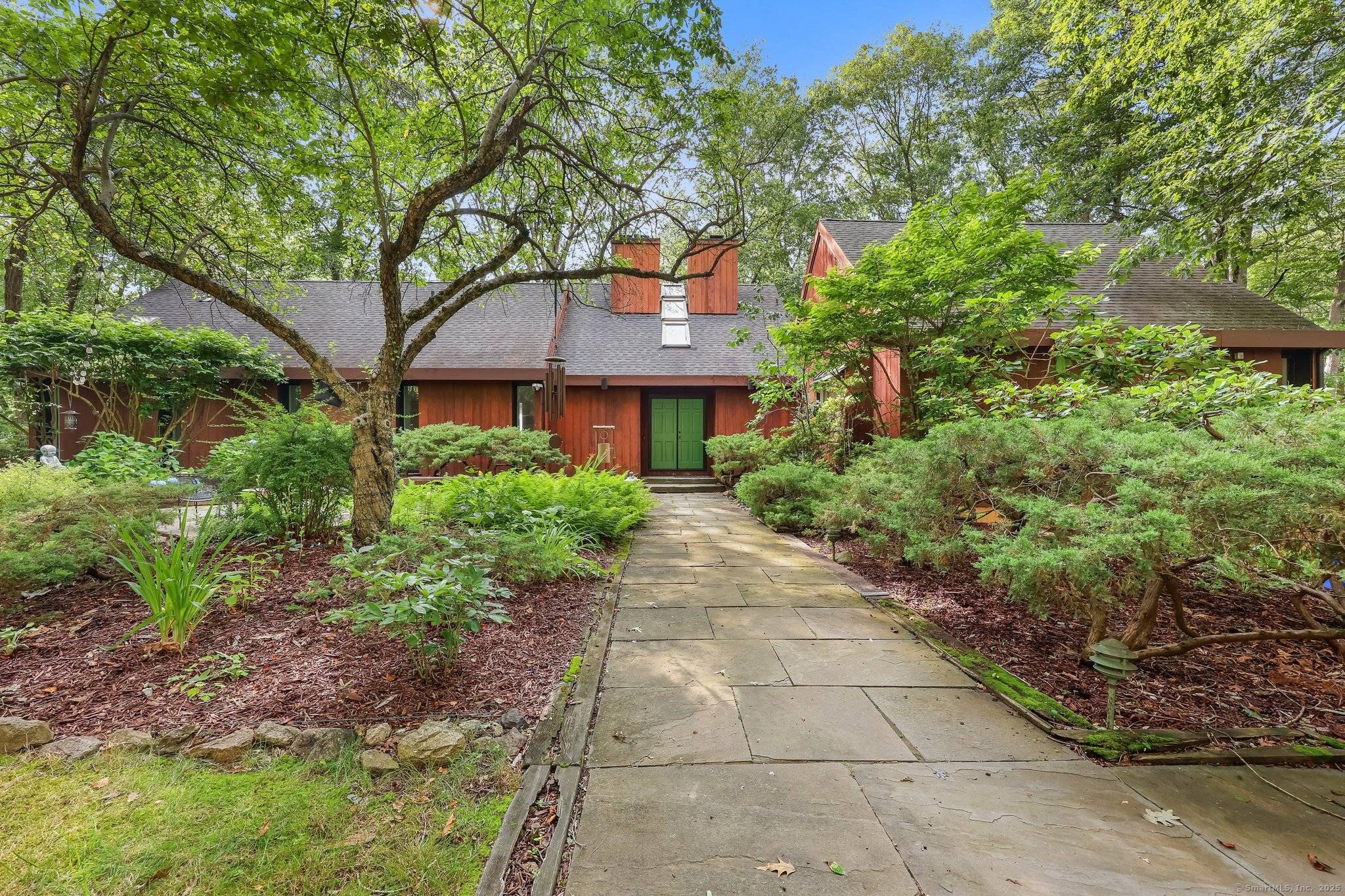 Welcome home to this award winning contemporary ranch, perfectly situated on a serene cul de sac.