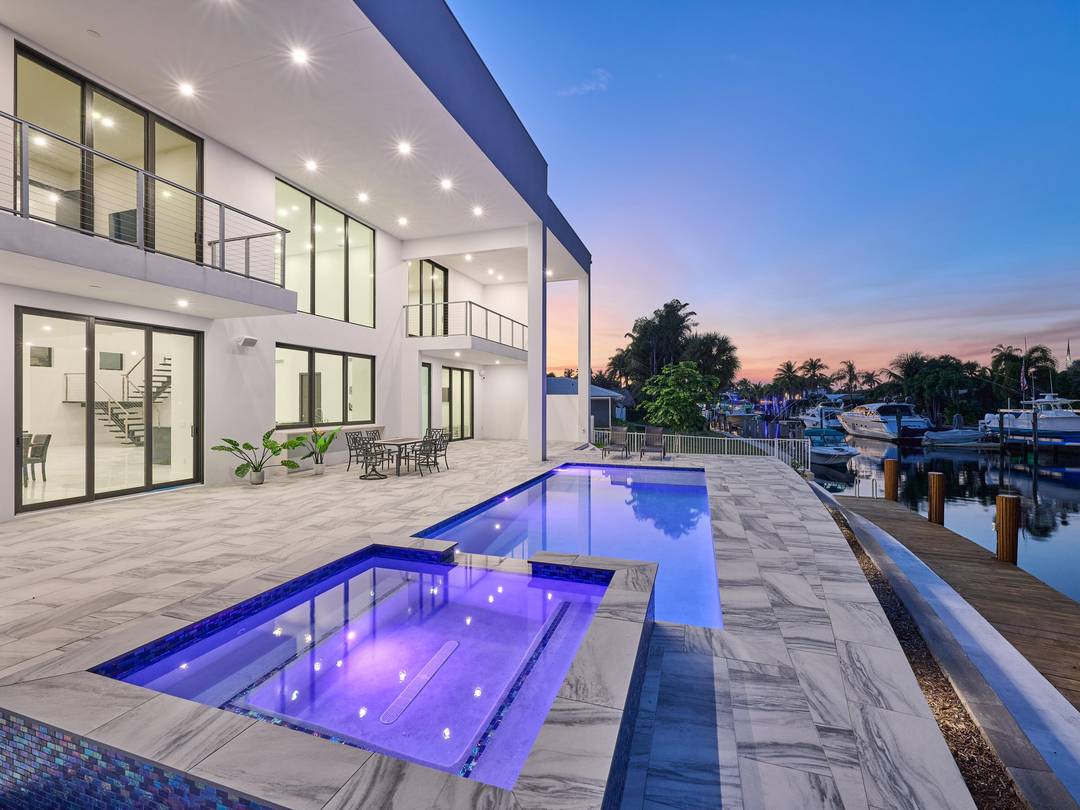 This exquisite, just completed 2025 modern waterfront masterpiece offers turnkey coastal luxury in the heart of South Florida.