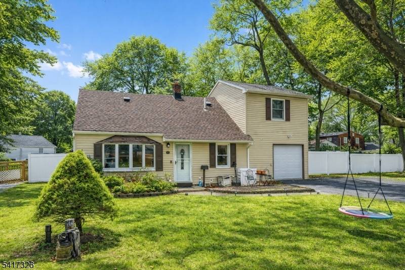 Welcome to this expanded Cape Cod home located in the highly desirable Pompton Plains section of Pequannock Township.