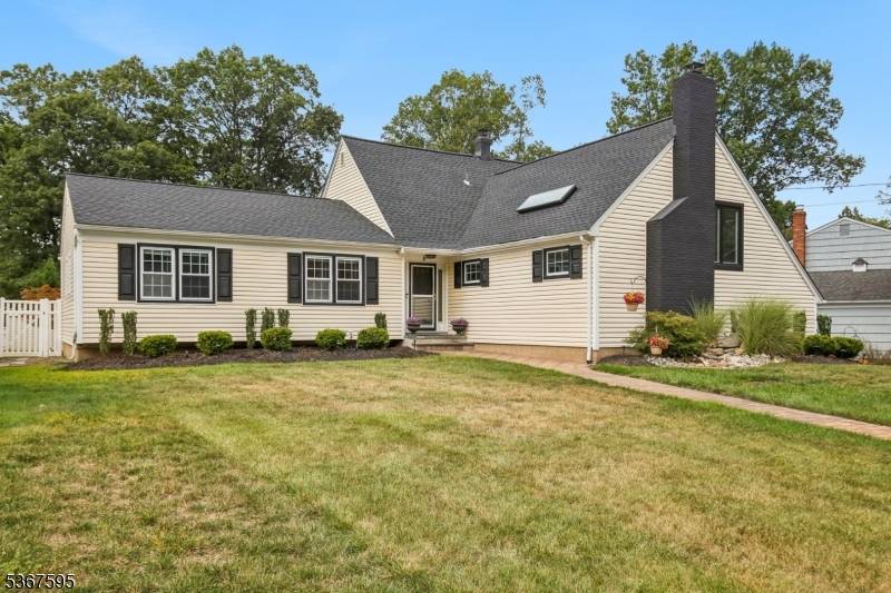 Charming, bright, unique expansive custom home on picturesque property in desirable Normandy Village.