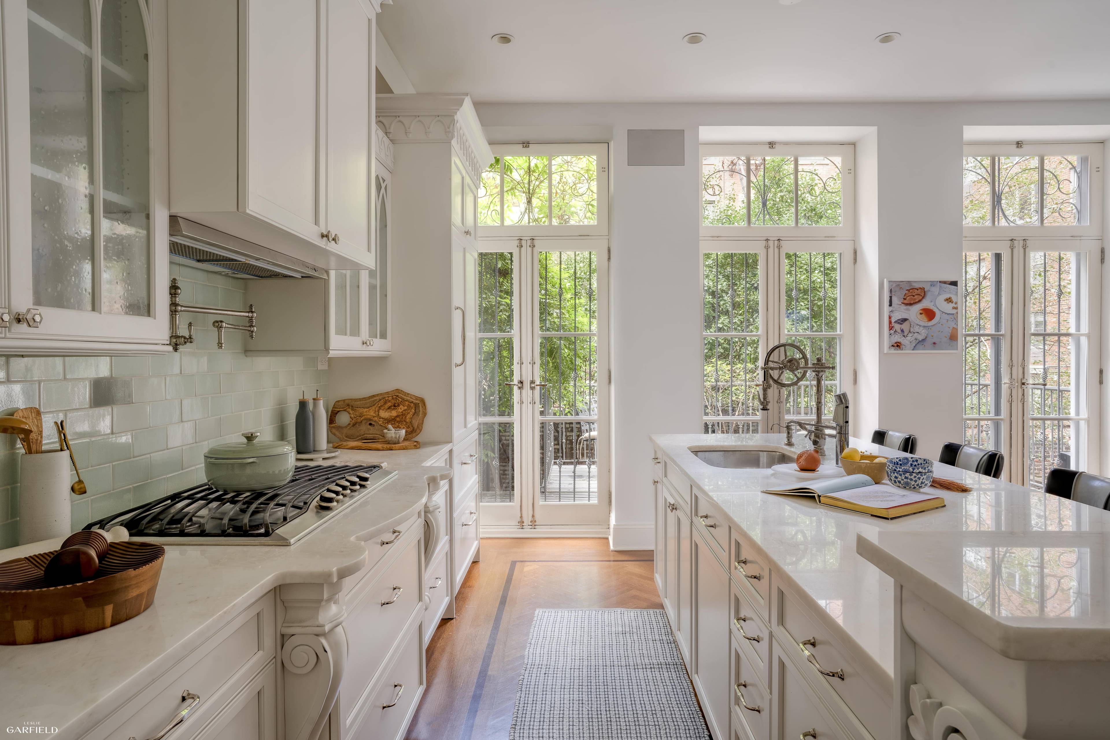 Nestled on one of Manhattan s most storied and picturesque blocks, this renovated single family townhouse offers the rare combination of historic charm and modern upgrades.
