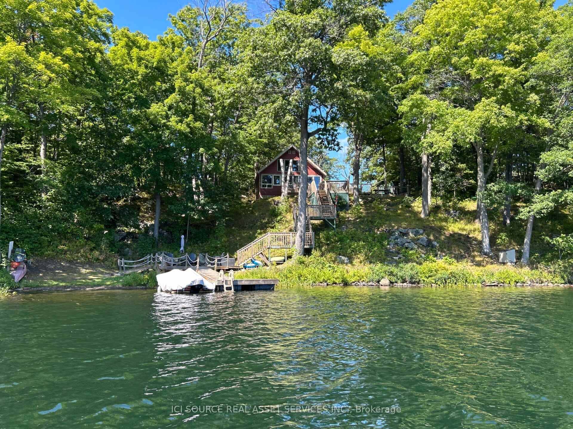 Welcome to 118 Pero Lane in picturesque South Frontenac, a beautifully upgraded 3 season, fully furnished waterfront cottage on sought after Sand Lake.