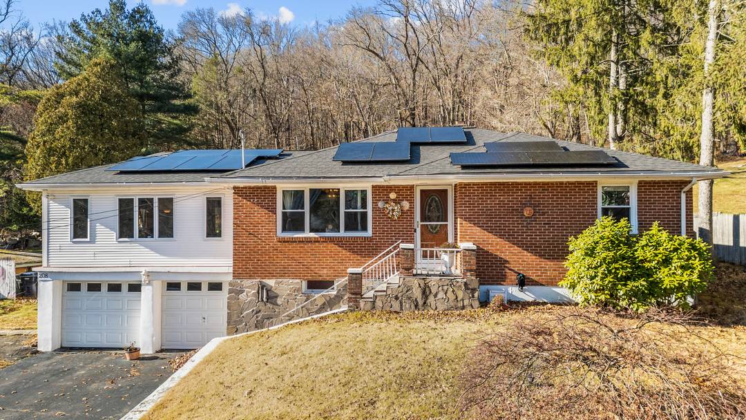 Charming 3 bedroom and 2 full bath ranch style home with a spacious backyard and a huge deck on 1.