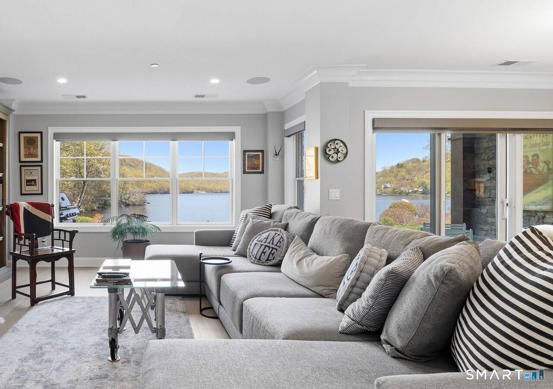 Perfectly positioned along the water's edge, this fully reimagined 2 bedroom, 2 bath residence at Poet's Landing offers turnkey living with sweeping lake views and effortless indoor outdoor flow.