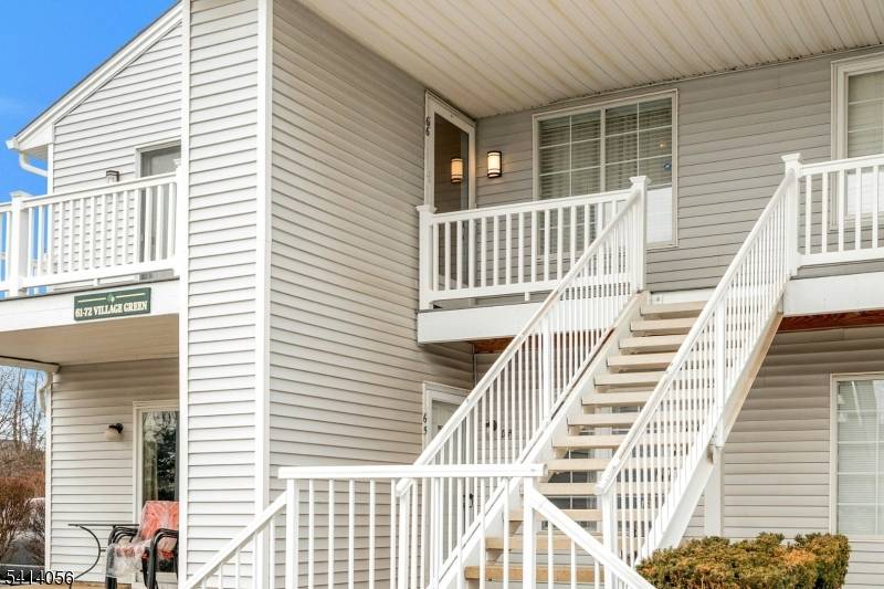 This renovated second floor condo in Village Green features 3 bedrooms and 1.