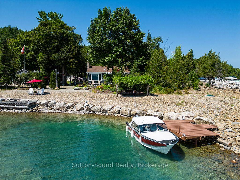 PRIVATE BAY AND BOAT DOCK ON 222 FT OF WATERFRONT.