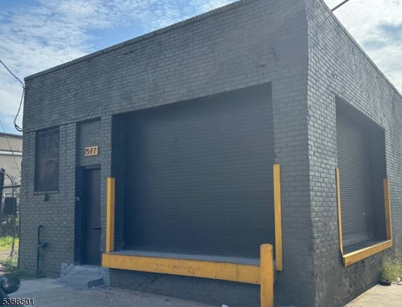 Warehouse featuring 2500 sq ft, corner property with a separate 25x100 lot number 75 Goble
