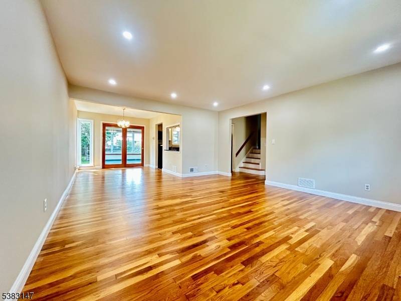 This meticulously renovated split level features a sunroom and a deck designed for all season enjoyment, a master bedroom with attached bathroom, two additional bedrooms on the second floor, a ...