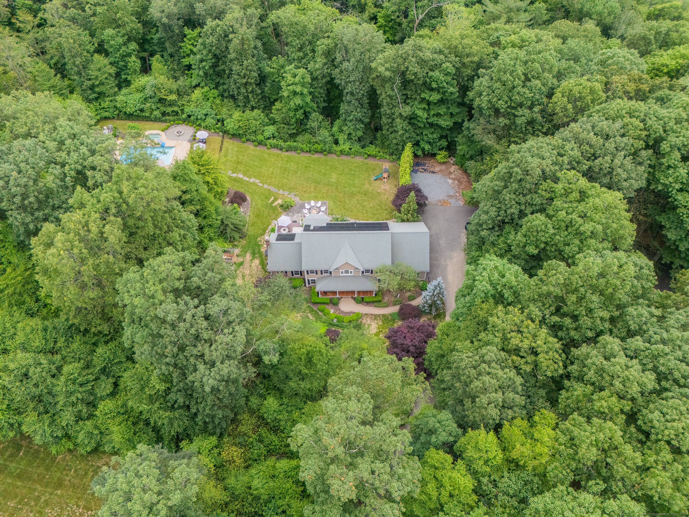 Welcome to your private 6, 000 square foot colonial estate, perfectly situated on 2.
