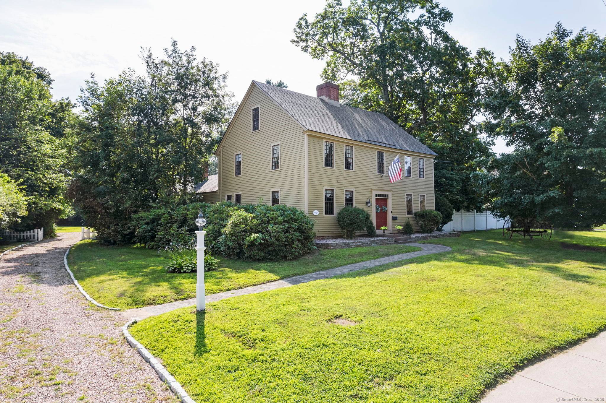 Step into a timeless piece of New England history with the Jehiel Hale House, a distinguished 1795 Colonial, gracefully sited on Glastonbury's coveted Main Street.