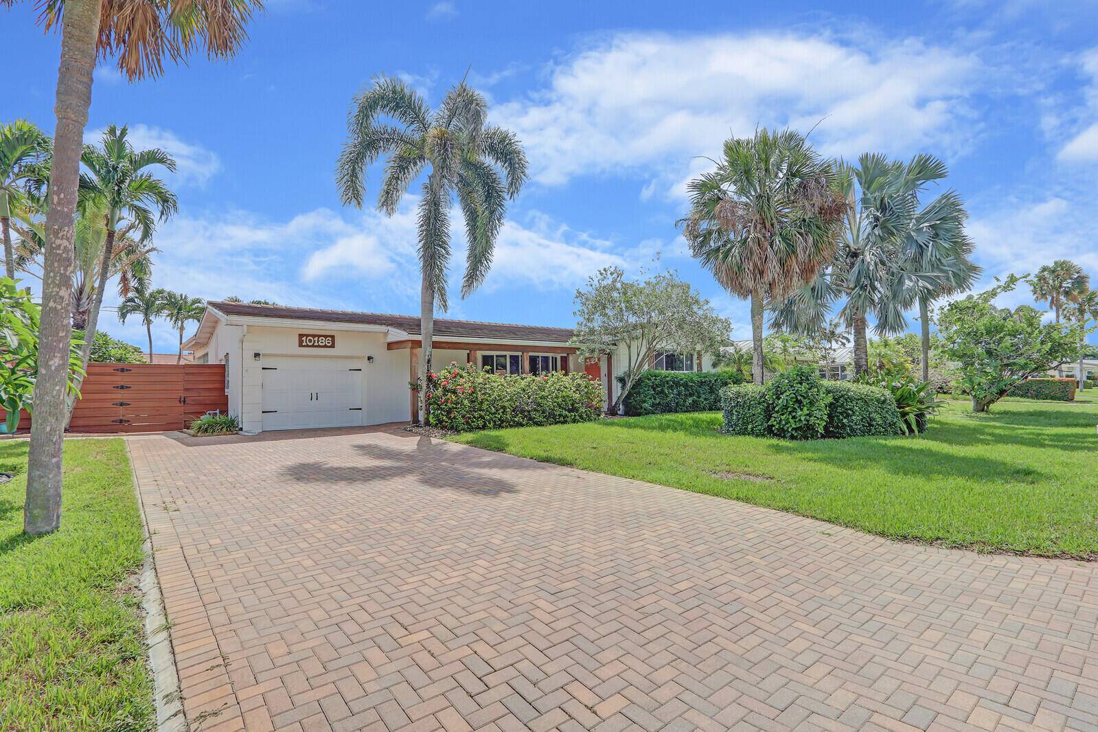 Welcome to 10186 Daphne Avenue, a beautifully maintained 3 bedroom, 2 bathroom home in a desirable, no HOA neighborhood of Palm Beach Gardens.