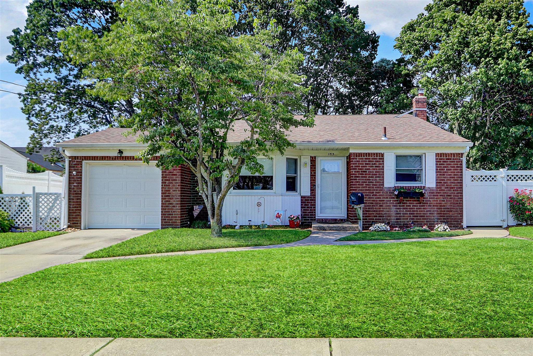 This pristine front to back split level, situated on a quiet mid block location, greets you with its attractive brick facade.
