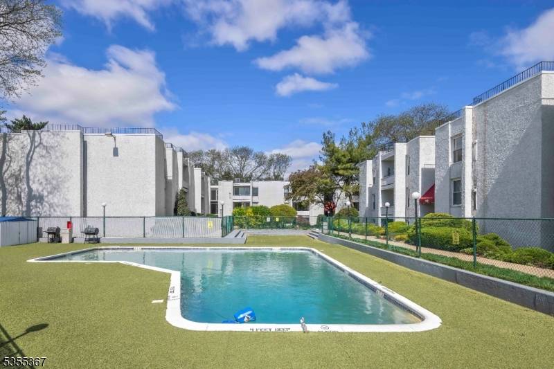 This Top floor condo featuring tall windows and abundant natural light.