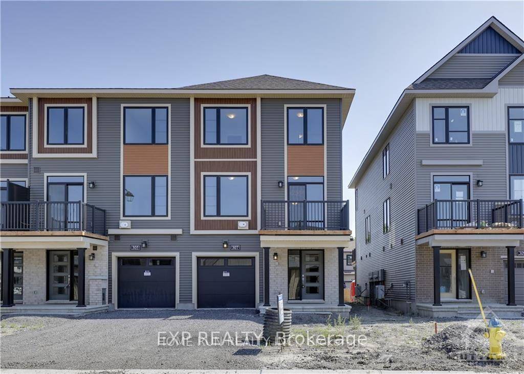 Enjoy stylish, low maintenance living in this sun filled back to back end unit townhome located in the vibrant community of Brookline.