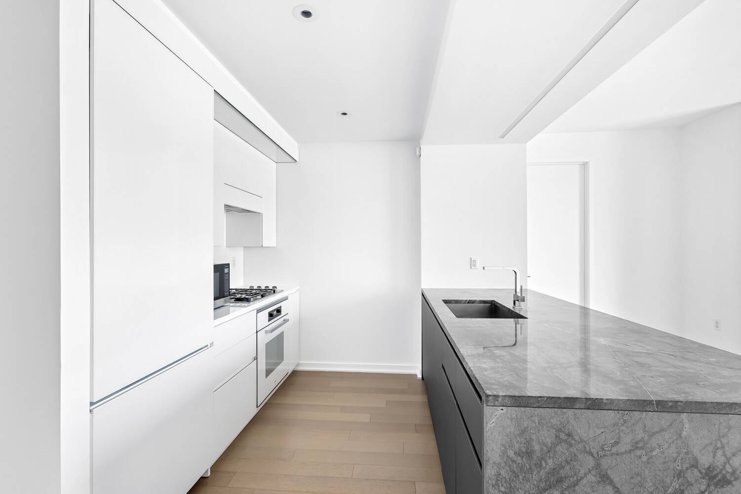 As soon as you step inside, you'll be impressed by the expansive living area and open kitchen design.