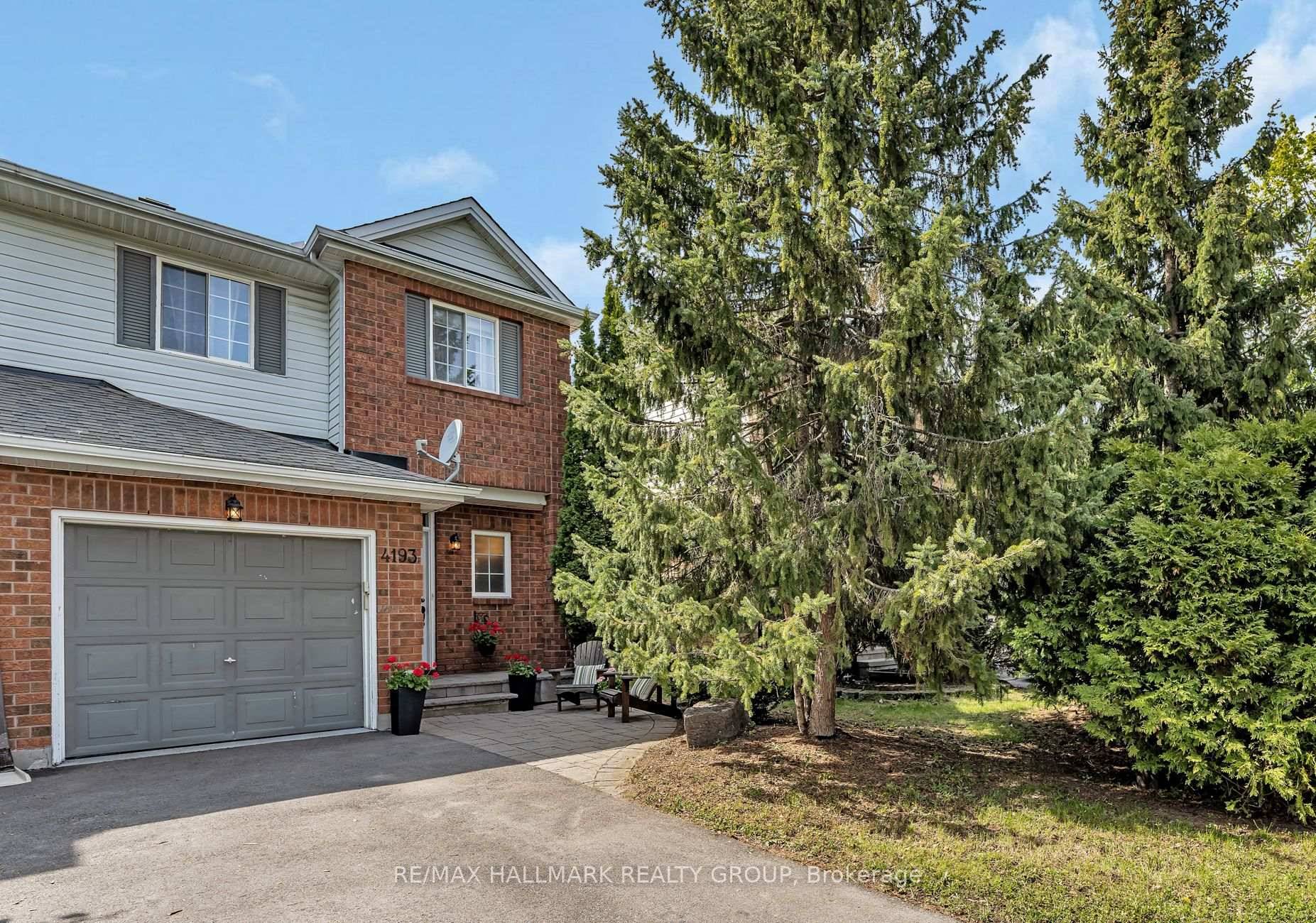 Welcome to this beautifully updated end unit townhome in Riverside South offering stylish living space and a fully finished basement.