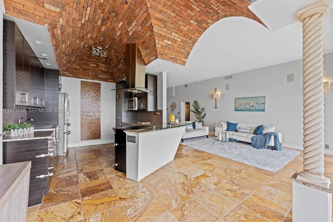 Experience penthouse living with breathtaking golf and city panoramas from a 50 ft balcony.