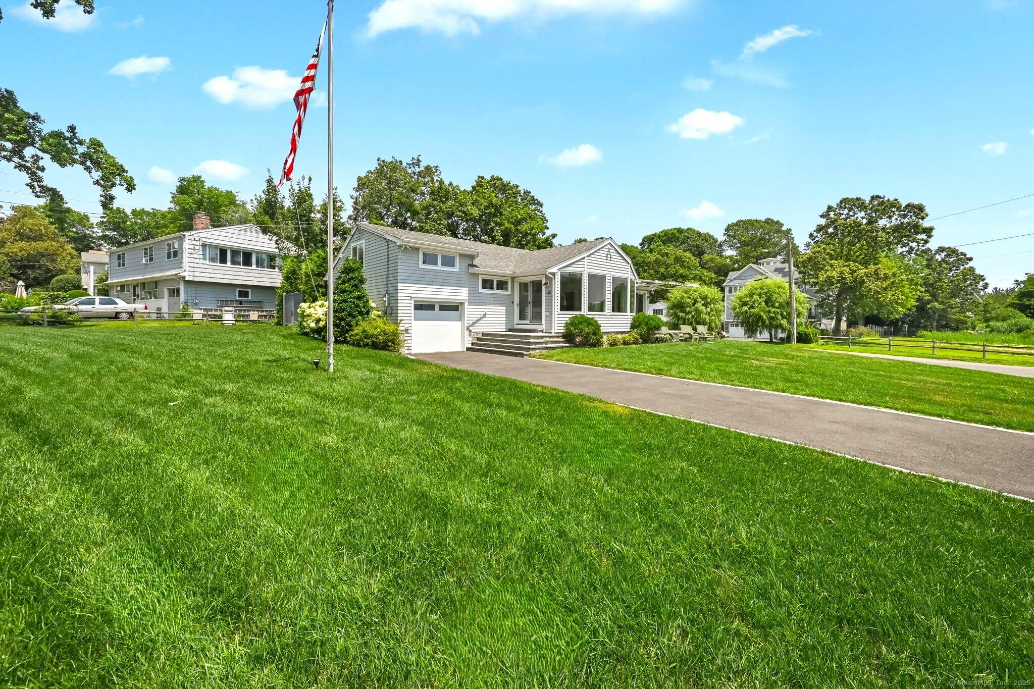 Direct Waterfront ! ! Spacious 4 bedroom 2 bath on expansive level fenced in yard patios with sweeping views of Long Island Sound.
