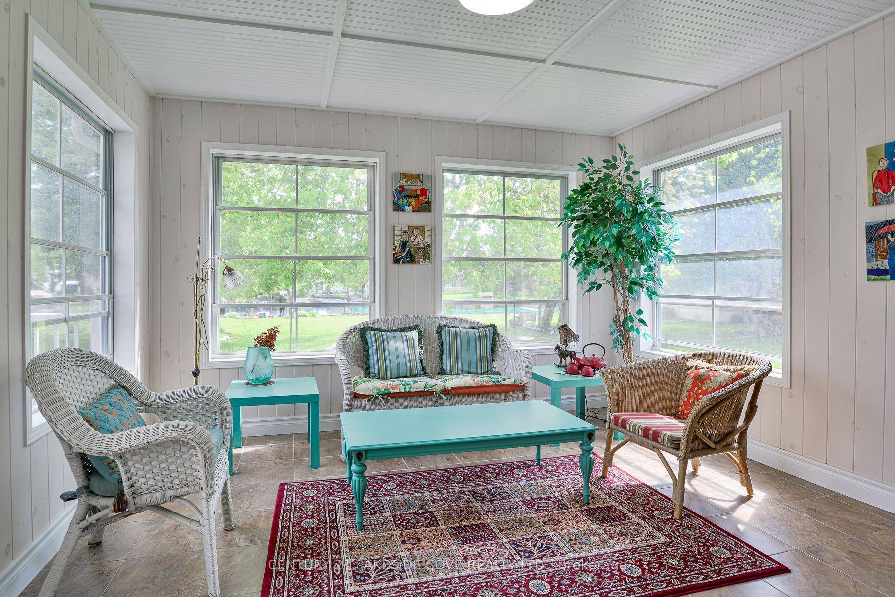 Discover the Charm of this Immaculate Waterfront Bungalow, Which Boasts an Impressive 70 feet of Picturesque Waterfront, Perfect for Enjoying Serene Fall Views.