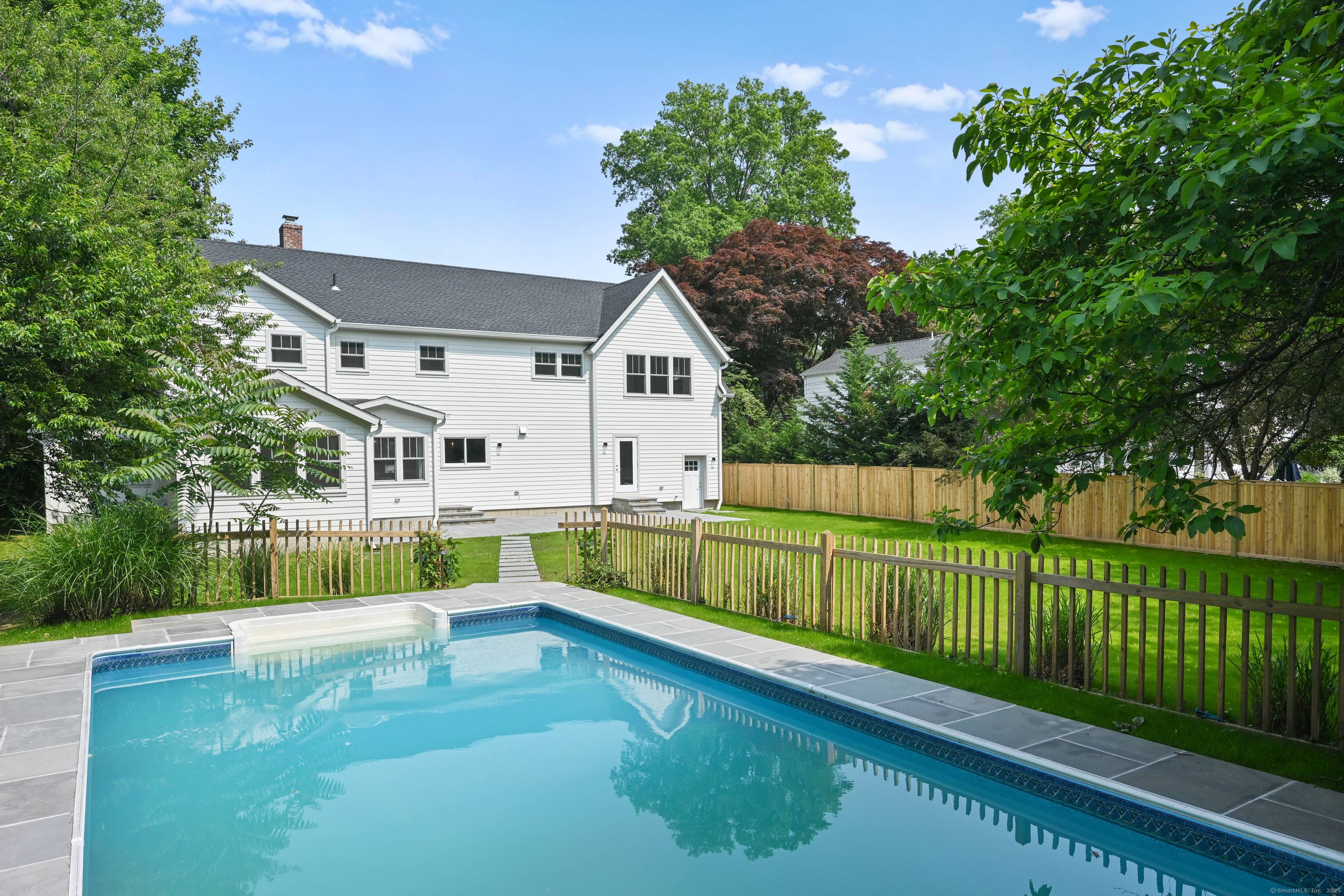 This architect designed home offers approximately 4, 250 square feet of living space with five bedrooms and three bathrooms.