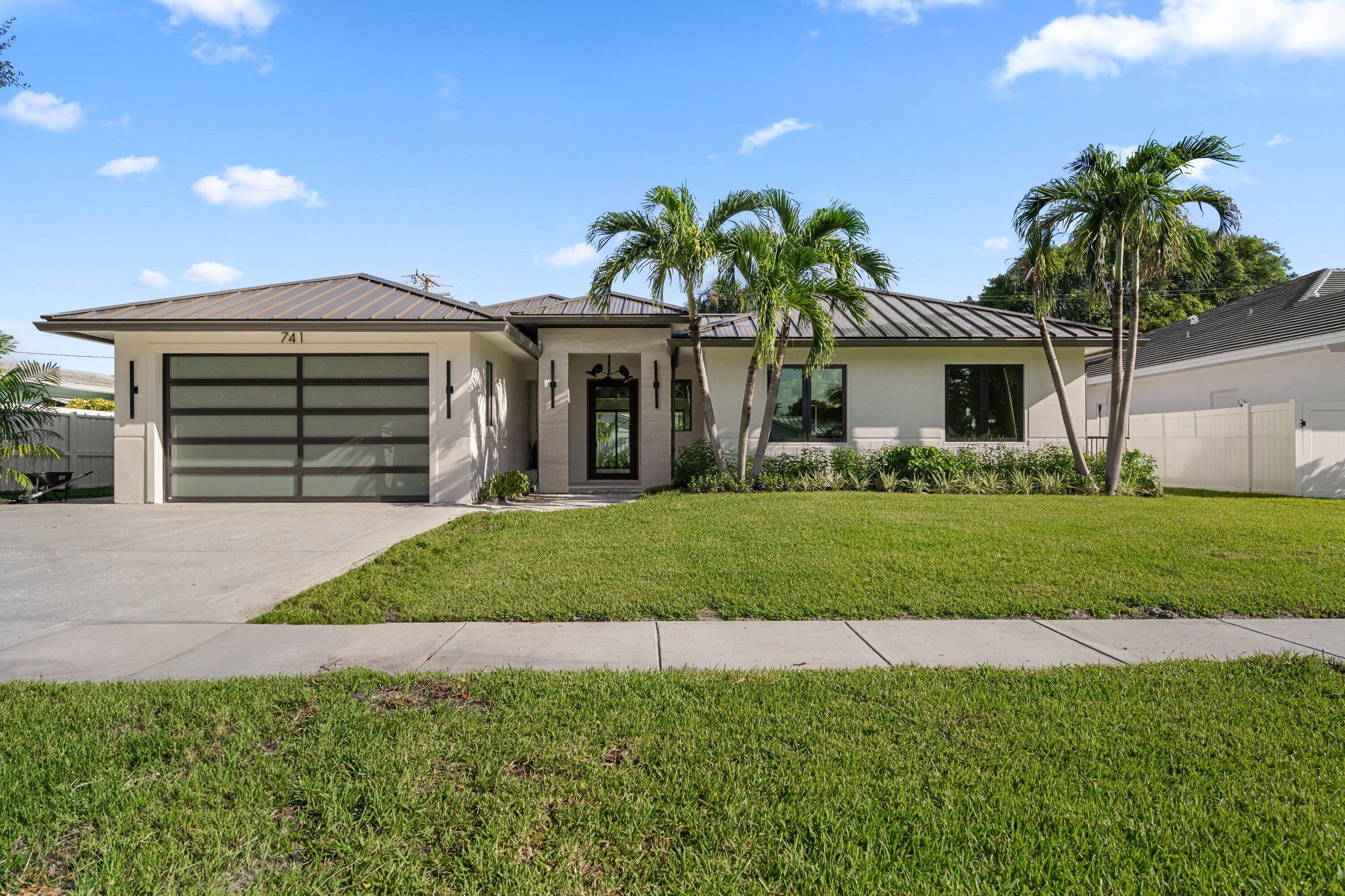 Welcome to this just completed 4 Bedroom residence with a sleek contemporary design, open concept floor plan and 10 ft ceilings throughout.