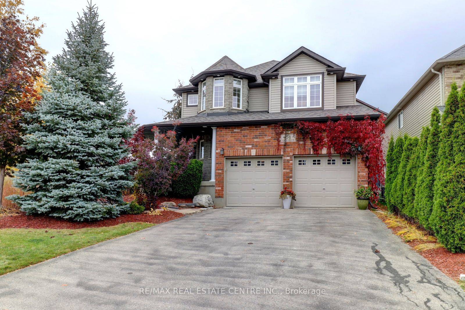 Spectacular Curb appeal w showstopper landscaping in front mature tree backdrop for perfect privacy in the back.