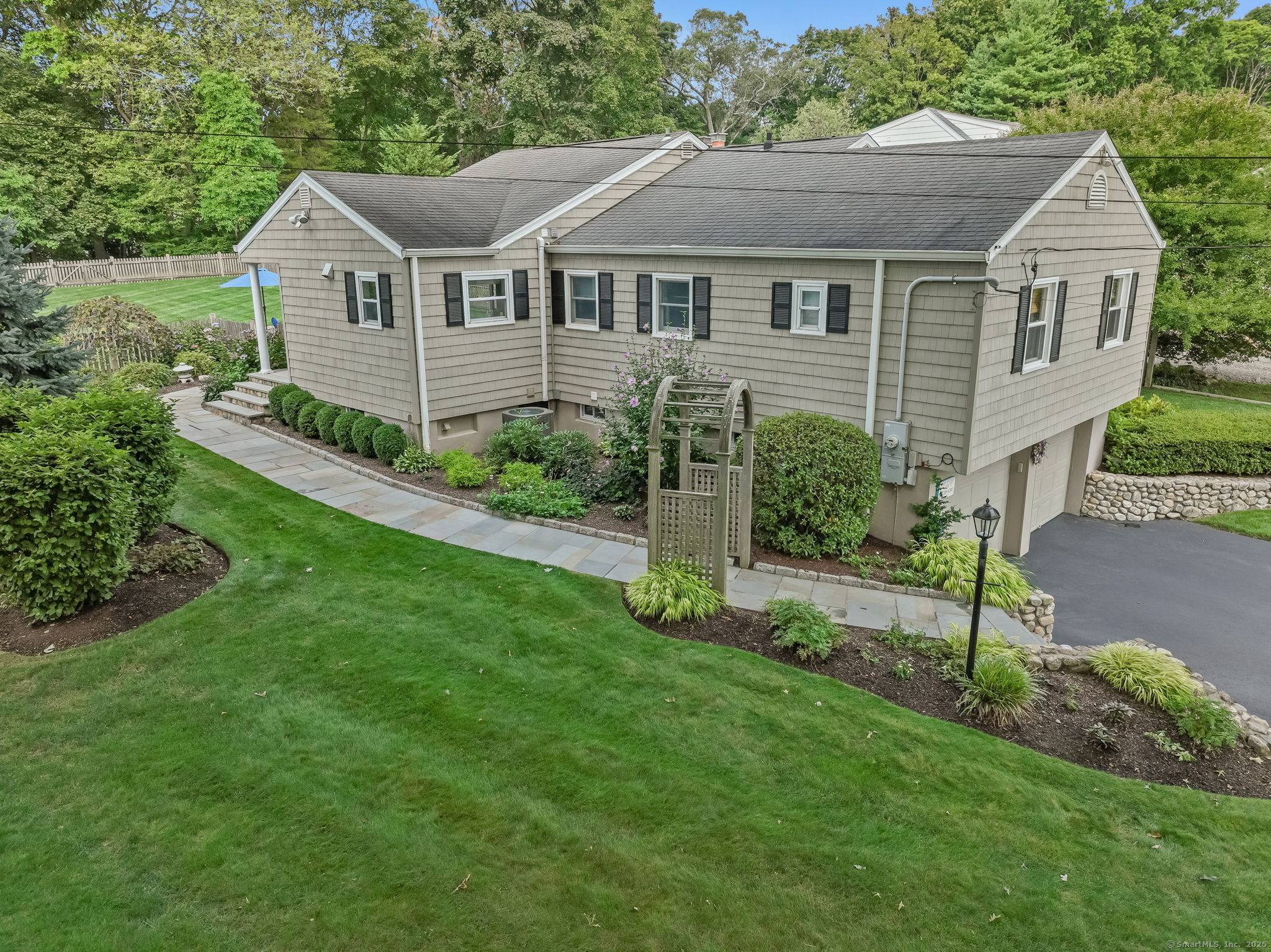 Stunning Ranch on nearly a 1 2 acre in a coveted University neighborhood on park like grounds !