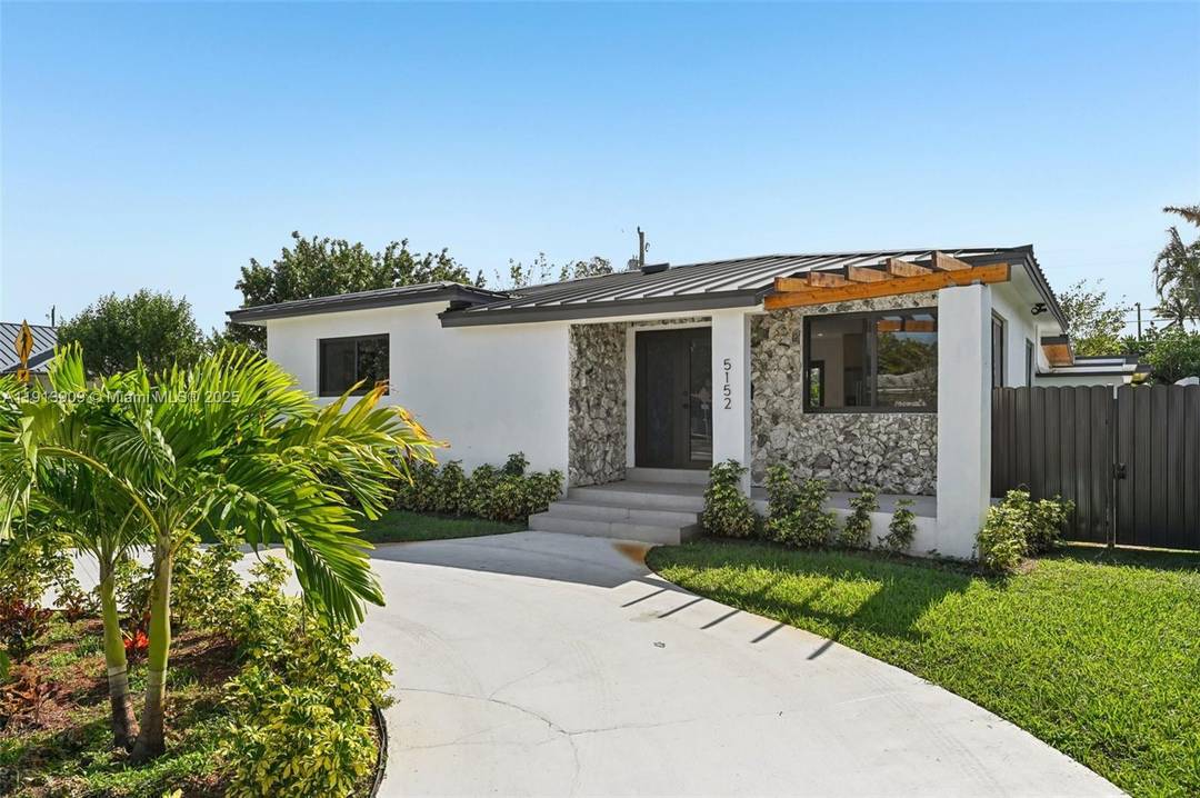 Coral Gables Area Beautiful corner property with 5 beds and 4 baths, ideal for families seeking extra income or investors.