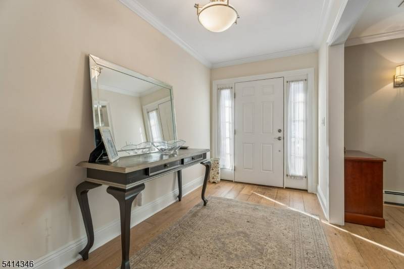 Welcome to this deceivingly large custom home in the heart of Pleasantdale.