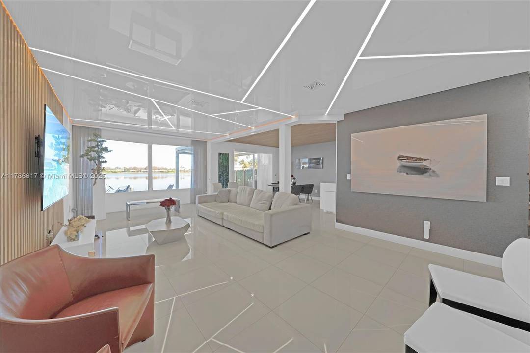 Discover this spacious 4 bedroom, 3 bathroom townhome nestled in the prestigious gated community of Doral Isles.