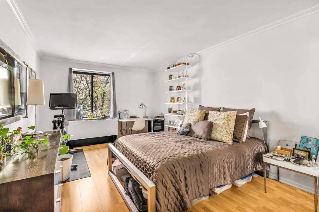 Light floors, and oversized windows create an inviting, airy ambiance with abundant natural light throughout the home.